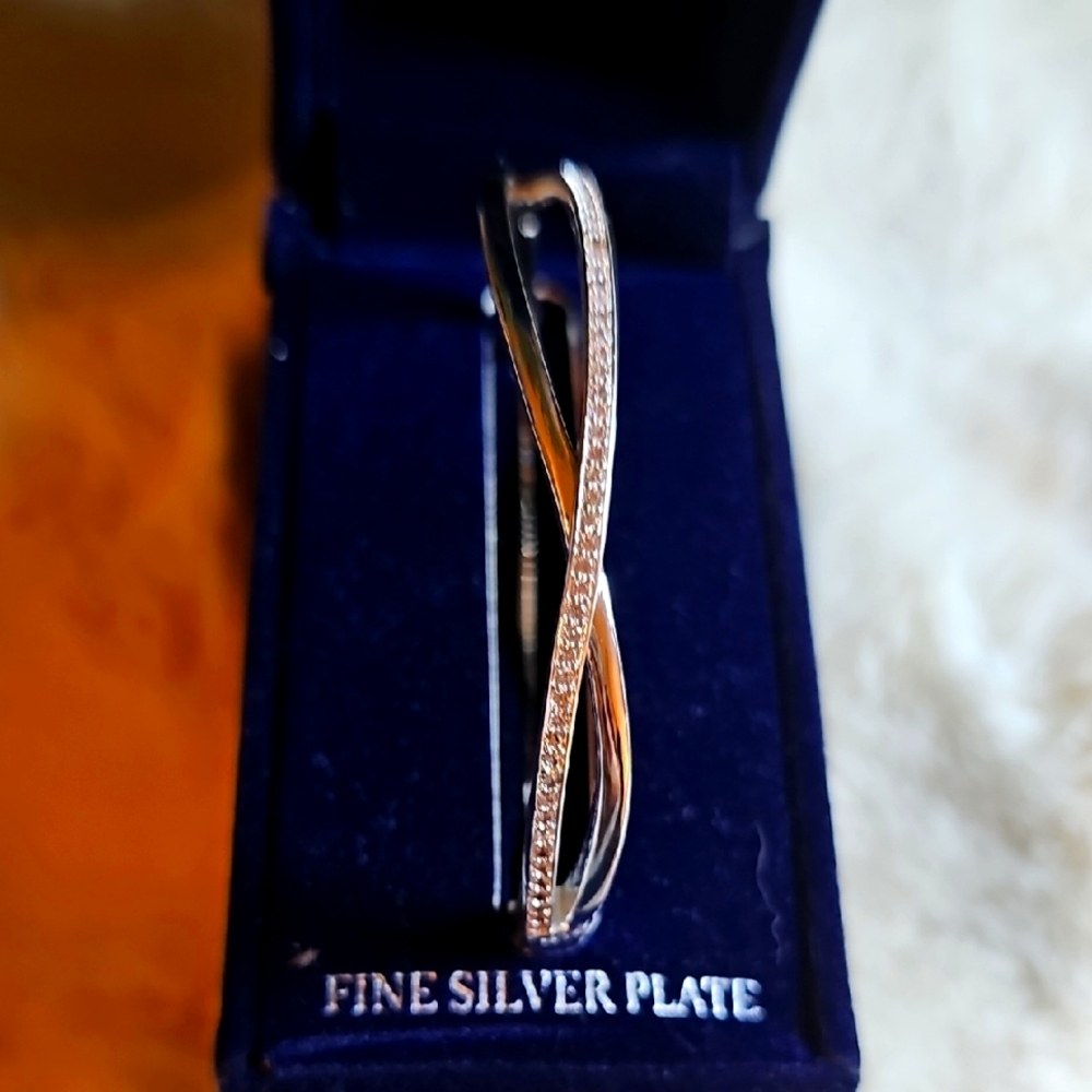 SPARKLE ALLURE Elegant Silver Plated Crossover Bangle.